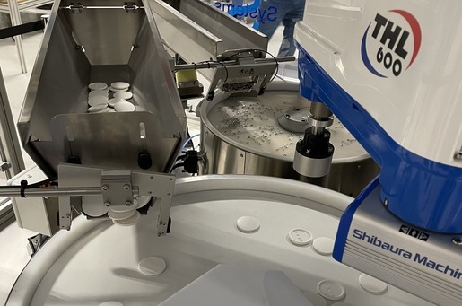FlexiBowl used within robotic assembly making badges