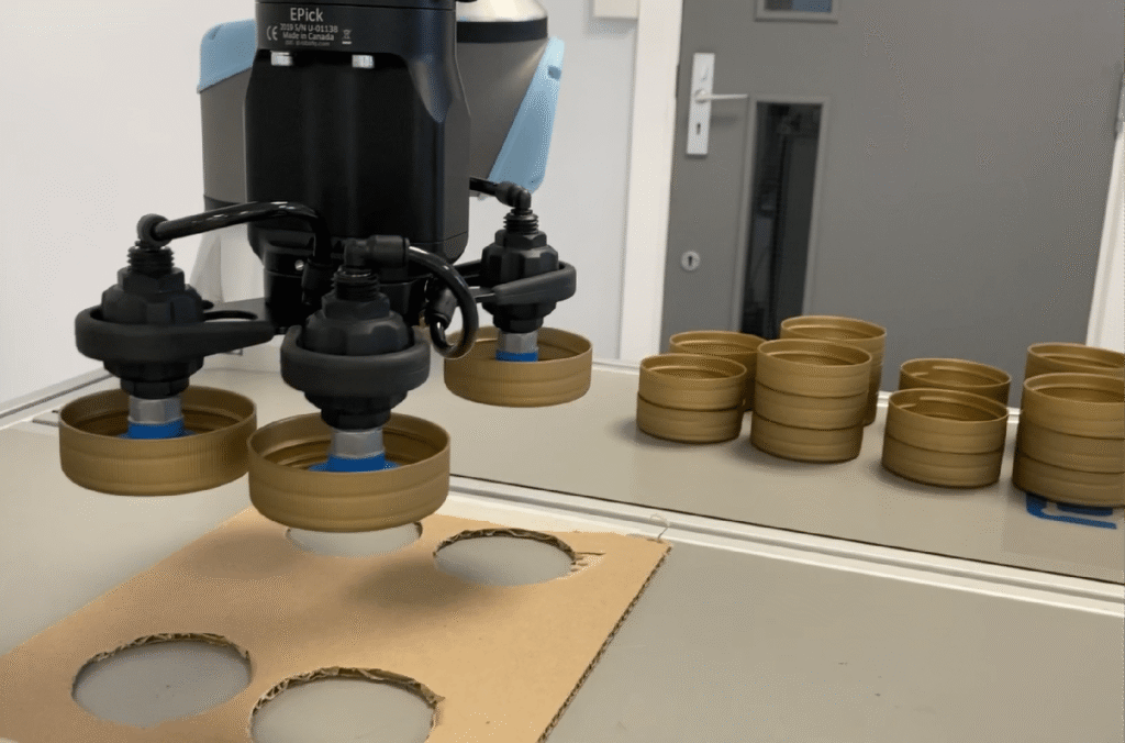 Vacuum robotic gripper on universal robots cobot collaborative robot pick and place feasibility study for packing application